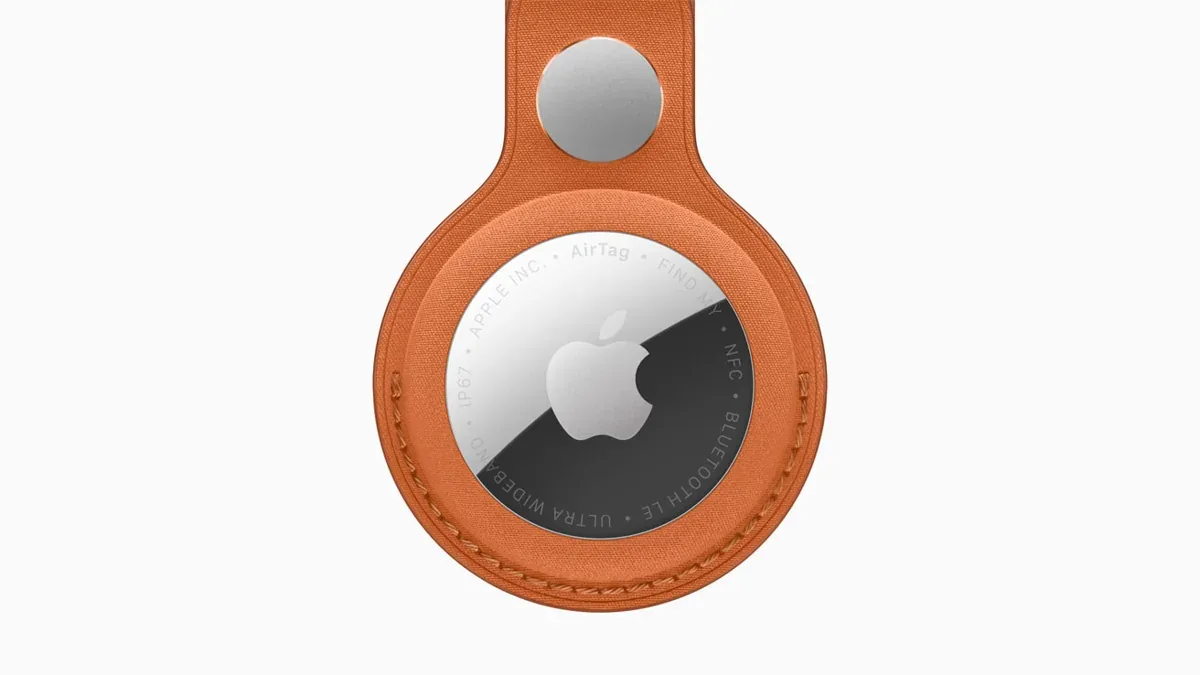 Apple AirTag second generation in an orange FineWoven Key Ring