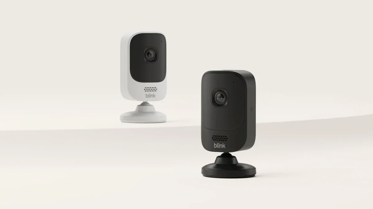 Official Blink Mini 4K+ photograph showing the white and black fixed-view cameras